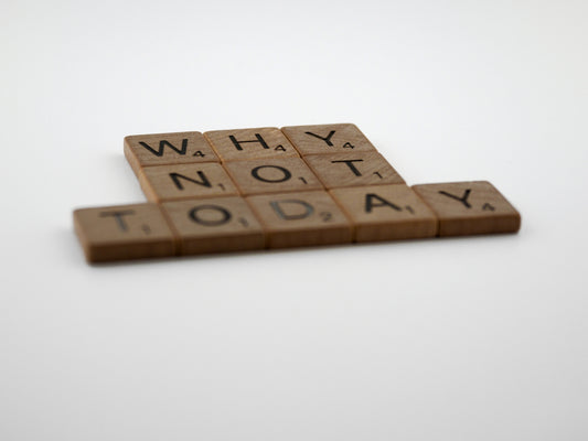 two scrabble tiles that say why not today